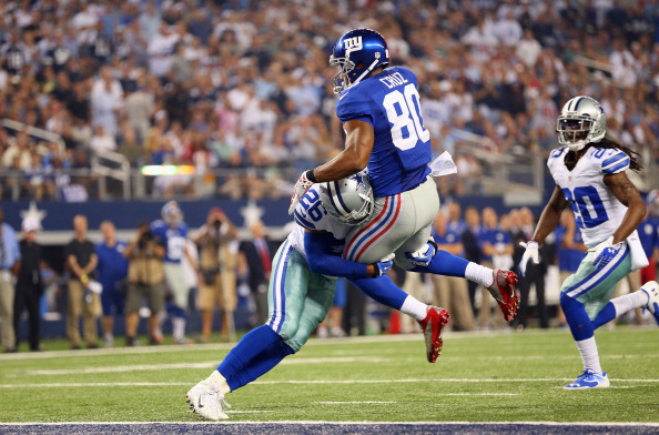 ARLINGTON, TX - SEPTEMBER 08:  Victor Cruz #80 of the New York Giants makes a touchdown pass reception against  Will Allen #26 of the Dallas Cowboys in the second half at AT&T Stadium on September 8, 2013 in Arlington, Texas.  (Photo by Ronald Martinez/Getty Images)