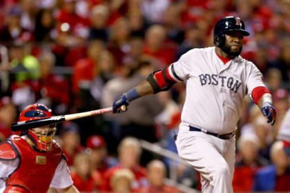 ST LOUIS, MO - OCTOBER 28:  David Ortiz #34 of the Boston Red Sox hits an RBI double scoring Dustin Pedroia #15 in the first inning against the St. Louis Cardinals during Game Five of the 2013 World Series at Busch Stadium on October 28, 2013 in St Louis, Missouri.  