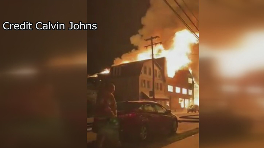 Flames shoot out of a Kittanning building.